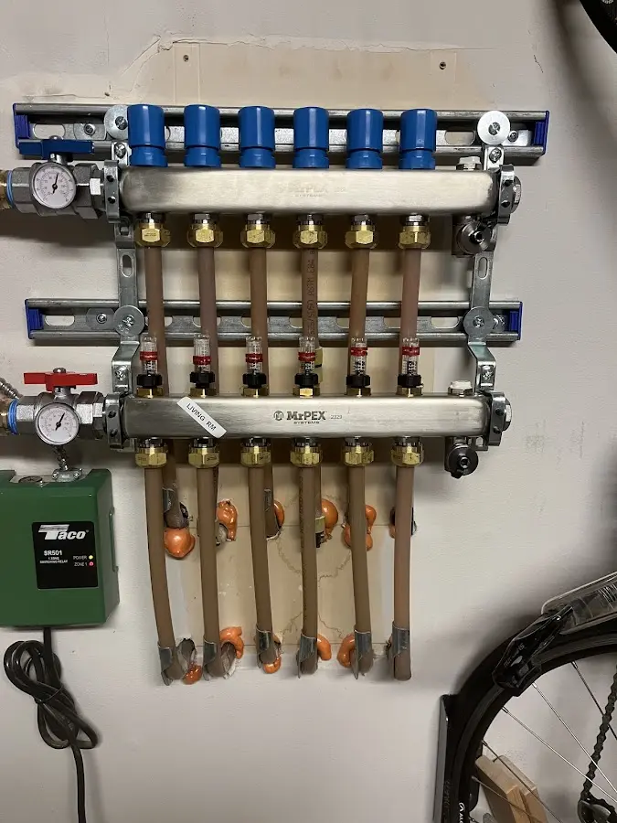 Plumber performing Water Heater Repair at a residential property in Laie